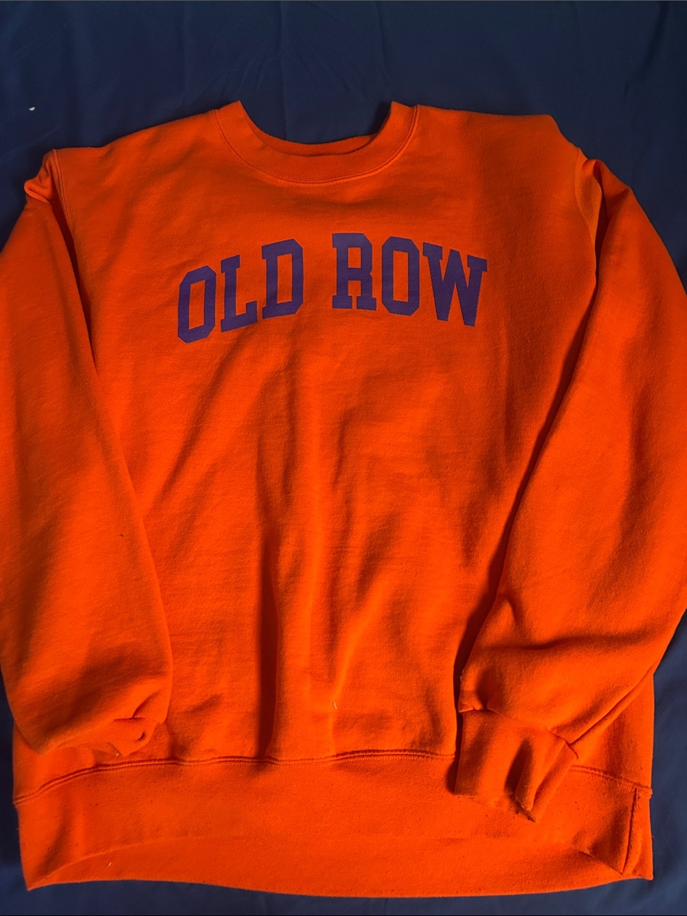 Champion Orange Crewneck Sweatshirt with Purple Collegiate Lettering